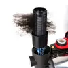 A close-up view of a water pump filter being cleaned, with dark debris being removed from a black filter element. Podgląd zdjęcia produktu