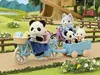 Sylvanian Families figures riding bicycles with a trailer in a park setting. Anteprima dell’immagine prodotto