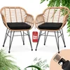 Two rattan chairs with black cushions are displayed on a white background, with greenery in the foreground and background. A red tag indicating '2er SET' is attached to one of the chairs. Produktbild-Vorschau