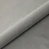 A rolled-up piece of gray fabric, likely velvet, is shown diagonally across a light gray background. Náhled obrázku produktu