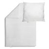 A white duvet and pillow are laid out on a white background. Produktbild-Vorschau