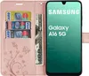 A pink wallet-style phone case with credit cards and cash inserted, next to a smartphone displaying the Samsung logo and 'Galaxy A16 5G'. Produktbild-Vorschau