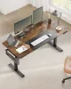 An overhead view of a home office setup with an adjustable standing desk. Produktbild-Vorschau