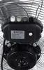 A close-up view of the control panel and motor housing of a fan. Voir les images du produit
