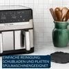 A kitchen counter with an air fryer, a pitcher of utensils, and a grill plate. Produktbild-Vorschau