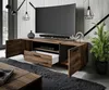 A modern living room setup featuring a TV stand with a TV, soundbar, and decorative items. Náhled obrázku produktu