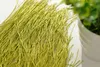 A close-up view of a pile of green thread curtains. Produktbild-Vorschau