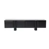 A black TV stand with four doors and cylindrical legs, presented against a white background. Produktbild-Vorschau