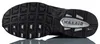 The underside of a black Nike Air Max Torch 4 sneaker. Voir les images du produit