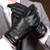Close-up of a person wearing black leather gloves. Produktbild-Vorschau