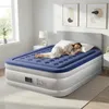 A woman is sleeping on an inflatable mattress in a bedroom. Podgląd zdjęcia produktu