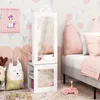 A child's bedroom with a bed, pillows, stuffed animals, and a white storage unit with a mirror. Náhľad obrázku produktu