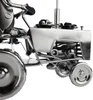 Close-up view of a metal sculpture of a tractor with decorative elements. Produktbild-Vorschau