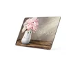 A thank you card with a vase of pink peonies and a smiling face on it, placed on a wooden surface. Produktbild-Vorschau