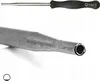 A close-up view of the tip of a carburetor adjustment tool, showing the hollow end. Above it, a full view of the tool with a black handle. Produktbild-Vorschau
