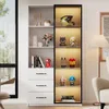 A white cabinet with glass doors and LED lighting, displaying various collectible items and books. Voir les images du produit