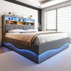 A modern bedroom with a grey upholstered bed featuring built-in shelving and LED lighting. Náhľad obrázku produktu