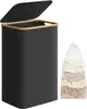 A black laundry hamper with a wooden rim and lid, shown next to a clear bag of laundry. Produktbild-Vorschau