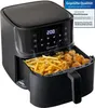 A black air fryer filled with french fries and fried chicken pieces, with steam rising. Produktbild-Vorschau