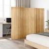 A room divider made of bamboo is placed between a bedroom area and a workspace. Produktbild-Vorschau