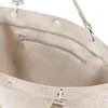 Close-up view of the interior of a beige tote bag, showing a zippered pocket. Voir les images du produit