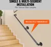 A black metal handrail installed on a wall next to a wooden staircase. Náhľad obrázku produktu