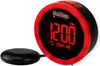 A close-up studio shot of a red and black digital alarm clock with a vibrating puck accessory. Voir les images du produit