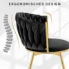 A close-up of a black velvet chair with gold legs, highlighting its ergonomic design. Produktbild-Vorschau