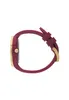 A side view of a burgundy and gold watch against a white background. Voir les images du produit
