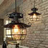 Two vintage-style pendant lights hanging in front of a brick wall. Produktbild-Vorschau