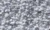 A close-up, overhead view of white perlite granules. Voir les images du produit