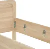 A close-up view of a wooden bed frame with metal brackets for assembly. Náhled obrázku produktu