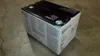 A product box for HP toner is shown on a concrete floor. Náhľad obrázku produktu