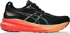 A side view of a black Asics Gel-Kayano 31 running shoe with an orange and pink gradient sole. Podgląd zdjęcia produktu