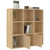A wooden bookshelf with multiple compartments, some of which are open and some have doors. Decorative items like books and a plant are placed on and inside the shelves. Náhled obrázku produktu