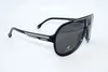 A pair of black Carrera sunglasses with grey lenses, shown on a white background. Produktbild-Vorschau