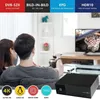 A couple watching TV, with a set-top box in the foreground and marketing text at the top. Podgląd zdjęcia produktu