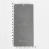 A screen protector is placed on a grid background with a ruler for scale. Produktbild-Vorschau
