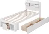 A white single bed frame with drawers and a headboard with storage compartments, shown with one drawer pulled out. Podgląd zdjęcia produktu