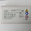 The image shows the back label of a white electronic device, likely a personal care appliance. Podgląd zdjęcia produktu