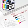 A set of printer ink cartridges is displayed on a stack of white paper, with marketing text and a diagram of a printer in the background. Produktbild-Vorschau
