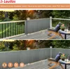 A balcony with a grey privacy screen installed along the railing, featuring outdoor furniture and a sunset view. Podgląd zdjęcia produktu