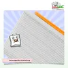 A close-up of a white pleated filter with an orange strip, set against a light blue striped background. A cartoon character of a filter bag is also present. Produktbild-Vorschau