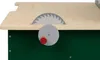 A close-up view of a toy workbench with a saw blade and a red knob. Produktbild-Vorschau