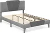 A grey upholstered bed frame with a slatted mattress support is shown against a white background. Náhľad obrázku produktu