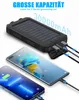 A solar power bank is shown charging two smartphones. Produktbild-Vorschau