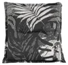 A square cushion with a tropical leaf pattern. Produktbild-Vorschau
