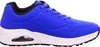 A side view of a blue sneaker with a white sole. Voir les images du produit