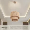 A pendant lamp with a woven shade hangs from the ceiling in a room with recessed lighting. Produktbild-Vorschau