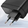 A close-up shot of a black electrical plug attached to a black power adapter. Voir les images du produit